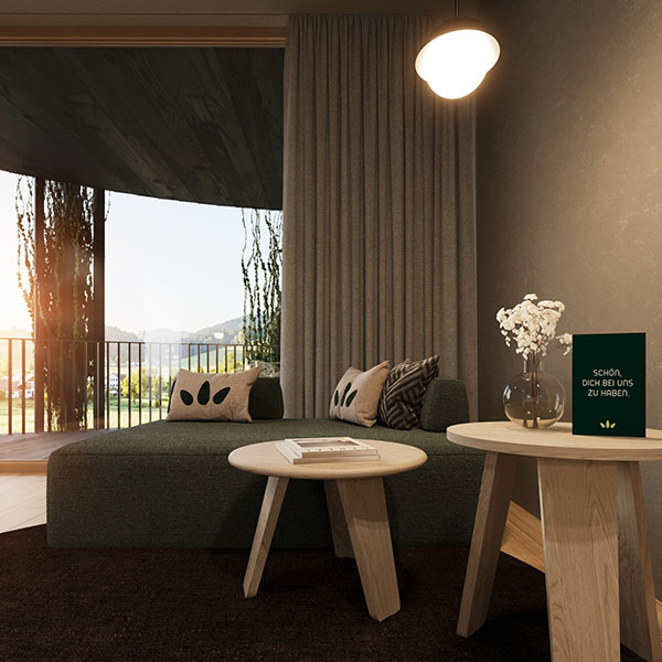 Schlafzimmer mit Holzbett, Sitzbereich und Blick zum Badezimmer